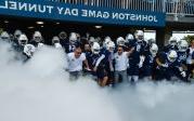 The Monarchs and coach Ricky Rahne rush onto the football field. Photo Chuck Thomas/ODU